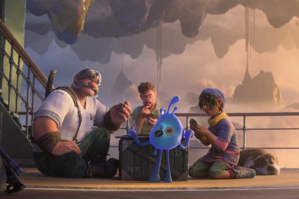 Jaeger (voiced by Dennis Quaid), Searcher (Jake Gyllenhaal) and Ethan (Jaboukie Young-White) make friends with a blue blob in "Strange World." 
