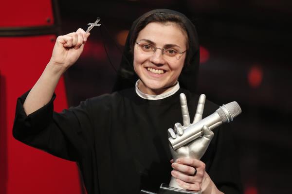 Sister Cristina Scuccia reacts after winning  the Italian State RAI TV program's final "The Voice of Italy" in Milan on June 6, 2014. 